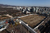 Jongmyo Shrine and the nearby Sewoon District 4 redevelopment site are seen in Seoul on Dec. 12. [YONHAP]