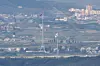 The North Korean and South Korean flags are seen hung up near the border seen from Paju, Gyeonggi, on Sept. 22. [YONHAP]