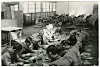 Prisoners of war in a camp in Busan weaving baskets on March 14, 1951. [ICRC/JACQUES DE REYNIER]