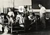 Medical staff members tending to the wounded at prison camp No. 100 in Korea, which had 245 prisoners of war, on July 26, 1950. On the far right is ICRC delegate Frederick Bieri. [ICRC]
