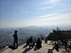 The greater Seoul region, as seen from Mount Inwang in Jongno District, central Seoul, is clouded in fine dust on Jan. 4. [BYUN SUN-GOO]