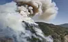 Smoke rises from a wildfire on a hillside in Hadong County, South Gyeongsang on April 7. [KOREA FOREST SERVICE]