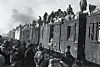 War refugees traveling on top of the train in Daegu on Dec. 29, 1950. [ICRC/JACQUES DE REYNIER]