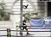 In a screen capture of a recent video released by the local news channel YTN, a crow strikes a man on the head before swiftly departing. [SCREEN CAPTURE]