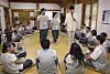 Gyeonwu No. 10 and Jiknyeo No. 8 hold hands during an icebreaker session at Naksan Temple in Gangwon on Friday. [PARK SANG-MOON]