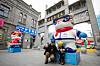 People take selfies with a Asian Winter Games mascot in Harbin, China on Oct. 29, 2024. [XINHUA/YONHAP]