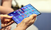 A customer looks at the Galaxy Z Fold 7 foldable smartphone at the Galaxy Studio store inside The Hyundai department store in Yeouido, western Seoul, on July 23, 2025. [NEWS1]