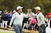 This file photo shows Adam Scott and An Byeong-hun react on the 17th green during day three of the 2019 Presidents Cup at Royal Melbourne Golf Course in Melbourne on Dec. 14, 2019. [GETTY IMAGES]