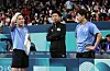Korean table tennis players Jang Woo-jin, left, Lim Jong-hoon react during the men's team quarterfinals at the Paris Olympics against China at the Paris Arena in Paris on Wednesday. [YONHAP]