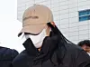 A woman suspected of giving a drug-laced drink that led to another person’s death at a motel in Gangbuk District, northern Seoul, attends a warrant review hearing at the Seoul Northern District Court in Dobong District, northern Seoul, on Feb. 12. [NEWS1]