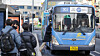 Commuters board buses at a bus stop near Seoul Station in Jung District, central Seoul. [NEWS1]