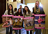 Student athletes hold signs during a hearing to consider bills to pass rules banning transgender student-athletes on April 1 in Sacramento, California. [AP/YONHAP]