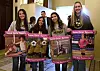 Student athletes hold signs during a hearing to consider bills to pass rules banning transgender student-athletes on April 1 in Sacramento, California. [AP/YONHAP]