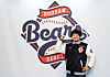 New Doosan Bears pitcher Ichiro Tamura poses in front of the team's logo at Jamsil Baseball Stadium in Seoul on Dec. 4 after signing a contract with the KBO club. [YONHAP]