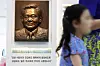 A child walks by a facial sculpture of late Samsung Chairman Lee Kun-hee installed in a lobby at Seoul National University Hospital's Children's Hospital in central Seoul in July. [JANG JIN-YOUNG]