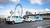 A fleet of black cab taxis showing Samsung Electronics' promotional banner for Busan's bid to host the World Expo 2030 are lined up in London. [SAMSUNG ELECTRONICS]
