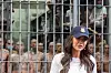 U.S. Secretary of Homeland Security Kristi Noem speaks during a tour of the Terrorist Confinement Center (CECOT) as prisoners stand, looking out from a cell, in Tecoluca, El Salvador, on March 26, 2025. [POOL/AFP/YONHAP]