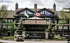 A worker uses a skid steer to move stone in front of the Pomeroy Kananaskis Mountain Lodge where the G7 Leaders meeting will take place from June 15 to 17, is pictured in Kananaskis, Alberta, Monday, June 2, 2025. [AP/YONHAP]