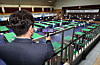 A National Election Commission official inspects a polling site at a middle school in Busan with a spy camera detector on Tuesday, a day ahead of the 2024 general election. [NEWS1]