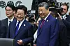 Korean President Lee Jae Myung, left, chats with Chinese President Xi Jinping ahead of the first session of the Asia-Pacific Economic Cooperation (APEC) summit at the Gyeongju Hwabaek International Convention Center in Gyeongju, North Gyeongsang on Oct. 31. [JOINT PRESS CORPS]