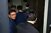 Qoo10 CEO Ku Young-bae enters his residence as it is raided by the prosecution on Thursday. [YONHAP]