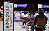 Applicants wait on a job interview during a job fair held at Songpa District office in Jamsil, Seoul, on May 14, 2021. [YONHAP]