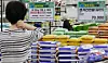 The average retail price of a 20-kilogram sack of rice has surpassed the psychological threshold of 60,000 won. According to data compiled by the Korea Agro-Fisheries & Food Trade Corporation on Sept. 3, the average price the previous day was 60,294 won, up 17.2 percent from a year earlier. The photo shows a rice section at a large supermarket in Seoul on the same day. [YONHAP]