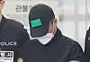 A man in his 50s who killed five members of his family in Yongin, Gyeonggi, is being transferred to the prosecutors' office on April 24 in Yongin. [YONHAP]