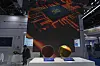 A man rests at the booth for Chinese dynamic random access memory producer ChangXin Memory Technologies during the SEMICON China 2025 event in Beijing on Nov. 20, 2024. [AP/YONHAP]