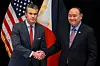 U.S. Secretary of Defense Pete Hegseth, left, shakes hands with Philippine Secretary of National Defense Gilberto Teodoro before a bilateral meeting on the sidelines of the Shangri-La Dialogue Summit in Singapore on May 30. [AFP/YONHAP]