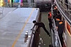 A Korean man attempts to jump off a cruise ship in Thailand before it has docked in July. [SCREEN CAPTURE]