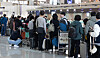 Passengers wait to pass through customs at Incheon International Airport on Feb. 27. Statistics Korea data showed that tourism and entertainment expenses increased in the fourth quarter of 2024 while spending on cars sharply declined. [NEWS1]