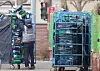 A worker organizes Rocket Fresh delivery parcels in front of Coupang's logistics center in Seoul on Dec. 28, 2025. [NEWS1]