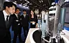 Visitors at the '2024 Busan International Nuclear Energy Industry Expo' held in April 2024, in Busan, look at a model of the APR1400, Korea’s homegrown nuclear reactor developed using entirely domestic technology. [SONG BONG-GEUN]