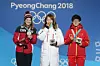 Short track speed skater Choi Min-jeong, center, poses with Canadian skater Kim Boutin, left, and Chinese skater Li Jinyu at the medal ceremony on Feb. 18, 2018, after she won gold in the 1,500-meter event at the PyeongChang Winter Olympics. [WOO SANG-JO]