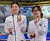 Short track speed skaters Shim Suk-hee and Choi Min-jeong pose with the Women’s Sports Award plaque presented by local broadcaster MBN on Nov. 15, 2017. [YONHAP]