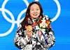 Short track speed skater Choi Min-jeong holds her gold medal on the podium during the medal ceremony on Feb. 17, 2022. Choi won her signature 1,500-meter event at the Beijing Winter Olympics. [NEWS1]