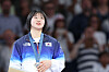Korean judoka Huh Mi-mi poses with her silver medal at the Paris Olympics at Champ-de-Mars Arena in Paris on Monday. [YONHAP]
