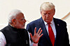U.S. President Donald Trump and India's Prime Minister Narendra Modi talk as they arrive for a joint news conference after bilateral talks at Hyderabad House in New Delhi, India, Feb. 25, 2020. [REUTERS]