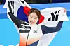 Short track speed skater Choi Min-jeong holds the Korean flag after winning her signature 1,500-meter event at the Beijing Winter Olympics on Feb. 16, 2022. [YONHAP]