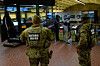 Members of the National Guard watch subway goers who attempted to jump the turnstile at the Smithsonian metro station in Washington on Dec. 31, 2025. [REUTERS/YONHAP]