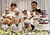 Military couple Captain Seo Hye-jeong, left, and Captain Kim Jin-su, right, hold their quintuplet babies during the children's first birthday party on Nov. 13, 2022. [YONHAP]