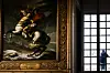 A photo shows the painting 'Napoleon Crossing the Alps' (1801) created by French painter Jacques-Louis David as a man looks out of a window in the Salle Marengo, next to the apartments of the President of Congress at the Chateau de Versailles, on Feb. 14. To mark the 150th anniversary of the Third Republic, the Chateau de Versailles is opening new rooms to visitors. [AFP/YONHAP]