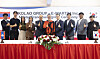 Officials from Emart24 and Kolao pose for photos after signing an agreement on a master franchise deal to open the Korean convenience store franchise in Laos on Sept. 25. [EMART24]