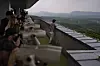 Tourists use binoculars to view North Korea from the Dora Observation Post in the demilitarized zone (DMZ) in Paju, Gyeonggi, on May 25, 2025. [AP/YONHAP]