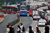 Buses are seen passing over a street in Jung District, central Seoul on May 28, after the Seoul bus union postponed a scheduled strike the same day. [YONHAP]