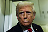 U.S. President Donald Trump looks on aboard Air Force One during travel to Palm Beach, Florida, from Joint Base Andrews, Maryland, on Nov. 25. [REUTERS/YONHAP]