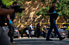 Law enforcement officers search the nearby neighborhood to clear the area after a shooting at Annunciation Catholic Church in Minneapolis, Aug. 27. [AP/YONHAP]