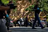 Law enforcement officers search the nearby neighborhood to clear the area after a shooting at Annunciation Catholic Church in Minneapolis, Aug. 27. [AP/YONHAP]