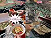 Photo, left, shows what baseball fan Seong Soo-bin ate at a baseball stadium. Captured photo, right, shows grilling samgyeobsal at a baseball stadium. [SEONG SOO-BIN, SCREEN CAPTRURE]